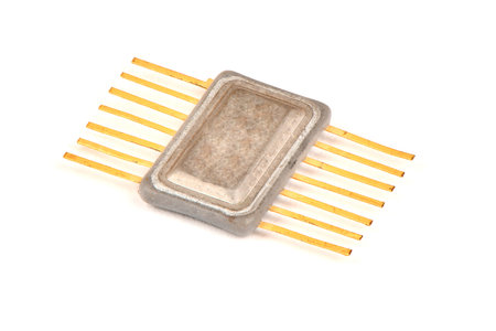 Old radio a component, an integrated chip in the metal case with the contacts covered with gold on a...