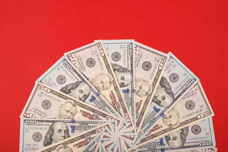Mandala kaleidoscope from money. Abstract money background raster pattern repeat mandala circle. On red background.の写真素材