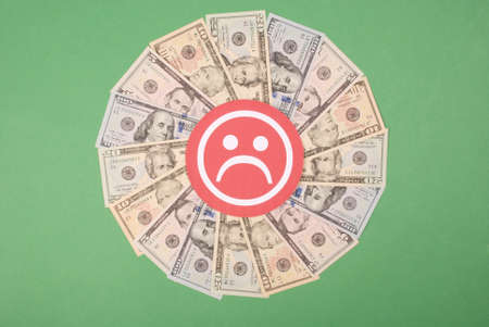 Sad smile faces on mandala kaleidoscope from money. Abstract money background raster pattern repeat mandala circle.の写真素材