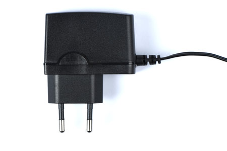 Black power ac to dc adaptor. Power adapter of router isolated on white background. High resolution...