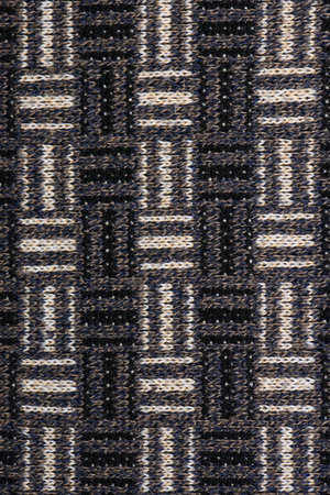 The texture of a knitted wool brown. Background. High resolution photo. Full depth of field.