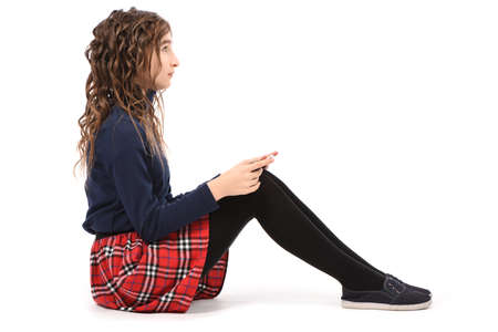 Pretty curly young girl smile and showing tablet pc isolated on white background. High resolution photo. Full depth of field.の写真素材