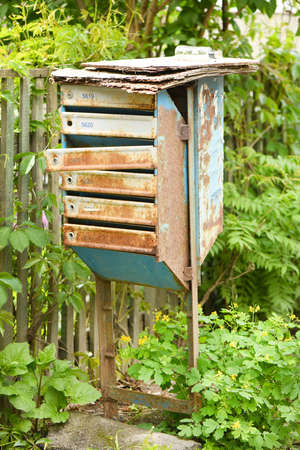 Old rusty fashioned mailbox on street background. High resolution photo. Full depth of field.の写真素材