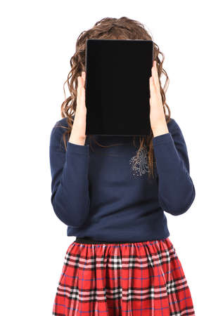 Portrait of pretty curly young girl smile and showing tablet pc isolated on white background. High resolution photo. Full depth of field.の写真素材