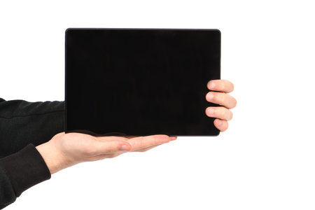 Hand holds tablet pc isolated on white background. High resolution photo. Full depth of field.