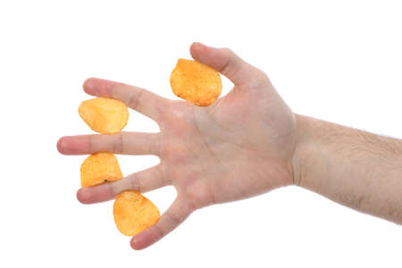 Male hand holding potato chips. Isolated on white background. High resolution photo. Full depth of field.の写真素材