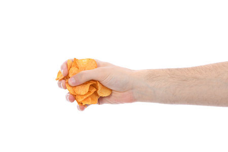 Male hand holding potato chips. Isolated on white background. High resolution photo. Full depth of...