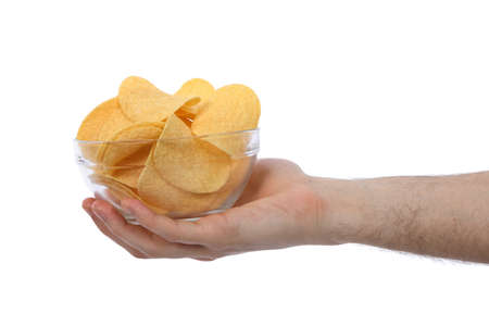 Male hand holding holding bowl full of potato chips. Isolated on white background. High resolution photo. Full depth of field.の写真素材
