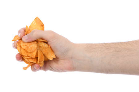 Male hand holding potato chips. Isolated on white background. High resolution photo. Full depth of field.の写真素材