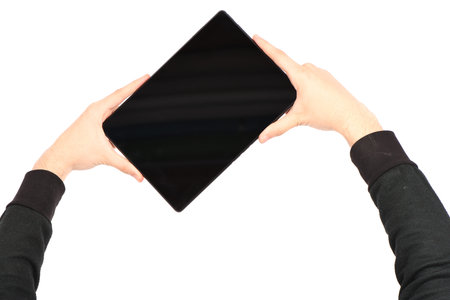 Hand holds tablet pc isolated on white background. High resolution photo. Full depth of field.
