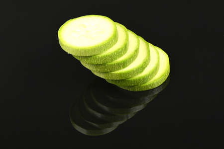 Zucchini isolated on acrylic black background. High resolution photo. Full depth of field.の写真素材