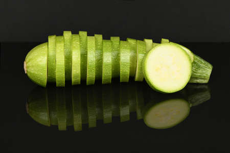Zucchini isolated on acrylic black background. High resolution photo. Full depth of field.の写真素材