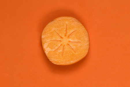 Orange ripe persimmon. Persimmon fruit. Orang fruits slice cut out. High resolution photo. Full depth of field.の写真素材