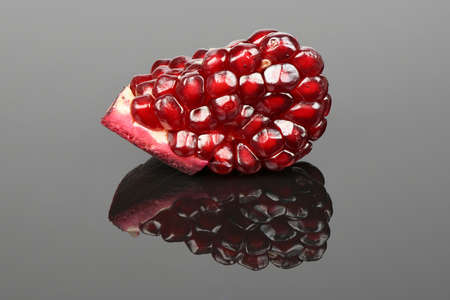 Garnet grains isolated on acrylic black background. High resolution photo. Full depth of field.の写真素材