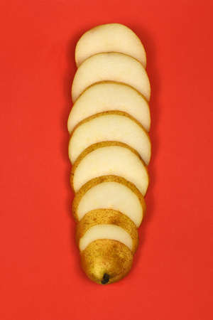 Pears isolated on red background. Pears macro studio photo. High resolution photo. Full depth of field.の写真素材