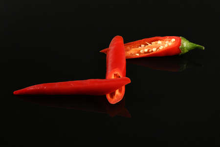 Red chili pepper isolated on black background. High resolution photo. Full depth of field.の写真素材