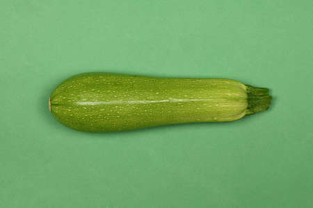Perfectly retouched zucchini isolated on green. High resolution photo. Full depth of field.の写真素材