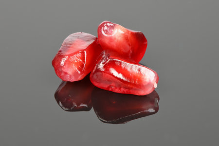 Garnet grains isolated on acrylic black background. High resolution photo. Full depth of field.の写真素材