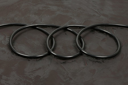 Black wire isolated on black background abstraction. High resolution photo. Full depth of field.
