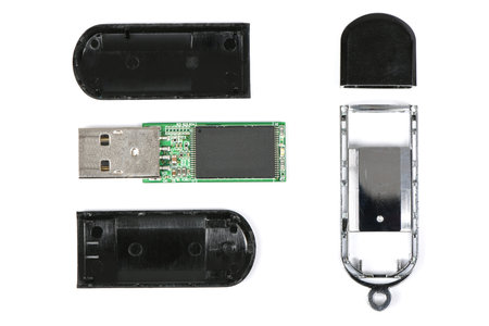 Disassembled flash drive on a white background. High resolution photo. Full depth of field.