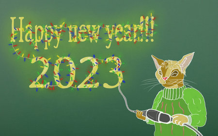 Domestic cat turns on a multi-colored garland that is wound on an inscription. Happy New Year 2023...