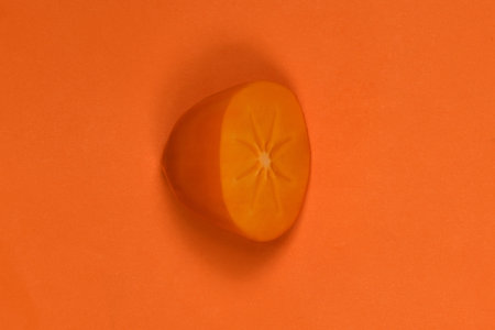 Orange ripe persimmon. Persimmon fruit. Orang fruits slice cut out. High resolution photo. Full depth of field.の写真素材