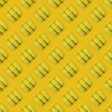 Seamless pattern. Pharmaceutical pills, medicine for people's health to heal diseases. Yellow tablets on yellow background. High resolution pattern. Full depth of field.の写真素材