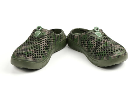 Pair dark green galoshes isolated on a white background. Shoes for rainy weather. High resolution photo. Full depth of field.の写真素材