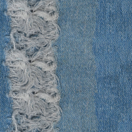 Seamless Ripped blue hipster jeans material. Destroyed denim Cloth texture. Close up. Seamless Torn jeans denim background texture. Blue Jeans fabric as material surfaceの写真素材