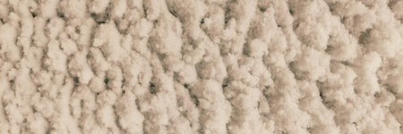 Snow flakes stuck in the form of waves on a white metal sheet. Close-up. Texture for Background.の写真素材
