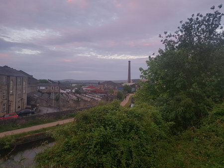 A view of the canal near sunset on a cloudy day.
