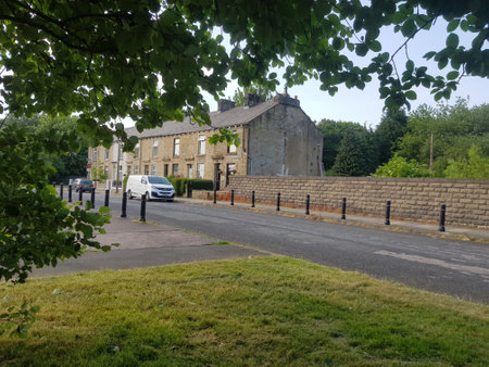 Picturesque summer landscape with a block of houses  on a quiet street at the edge of town on a beautiful day.の写真素材