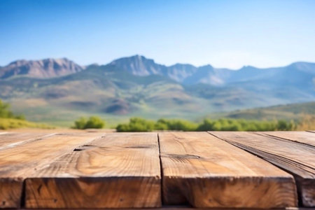 Wooden table in front of mountains. Empty table for product display montages.の素材