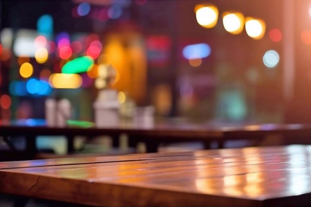 Empty wooden table and coffee shop blur background with bokeh image.の素材