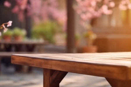 Empty wooden table and blurred background with cherry blossom tree in cafeの素材