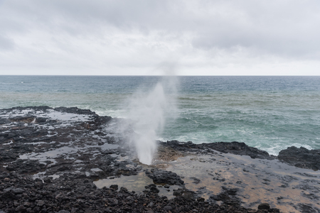 Spouting Horn at the southern tip of Kauai, Hawaii, in winter after a major rainstormの写真素材