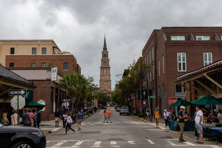 Scenic Charleston idiosyncratic street vista on a heavily overcast day, South Carolinaのeditorial素材