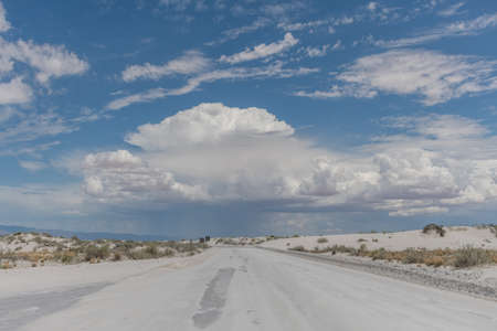 Beautiful gypsum dune vista at the White Sands National Park set against dramatic sky during the monsoon season, Southern New Mexicoの写真素材