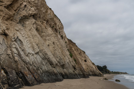 Natural oil seep at the bottom of the coastal cliff in Goleta, Southern Californiaの写真素材