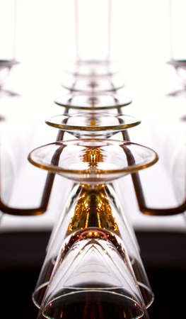 hanging wineglasses for Champagne in back lightの写真素材