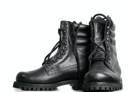 The high black leather boots isolated on white background