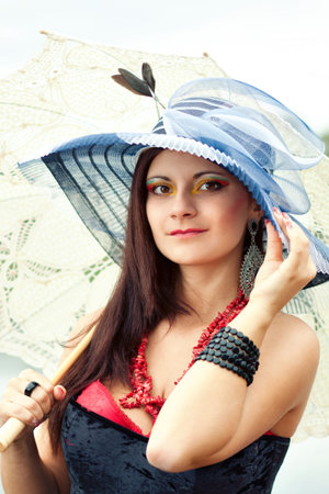 Portrait of an young lady in blue hat 