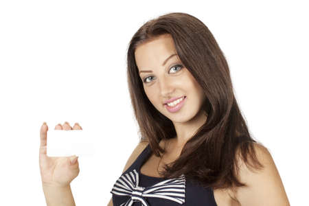 Beautiful woman showing blank business card isolated on whiteの写真素材