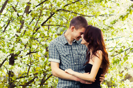 happy young couple in love outdoor in springの写真素材