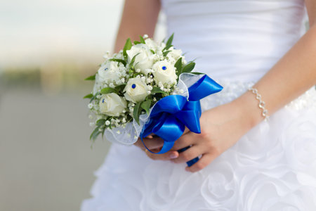 Beautiful wedding bouquet in hands of the brideの写真素材