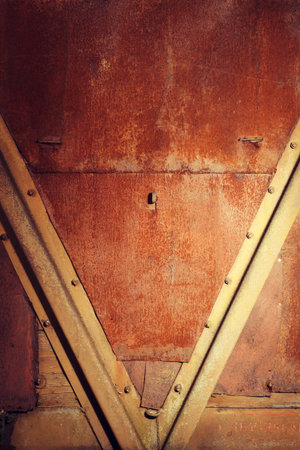 grunge rusty wet metal sheathing with rivetsの写真素材