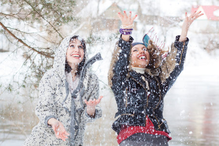 young women funny laughing outdoor in winter