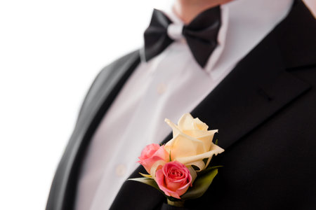 Boutonniere and bowtie close up. The groom's suit for the wedding ceremonyの写真素材