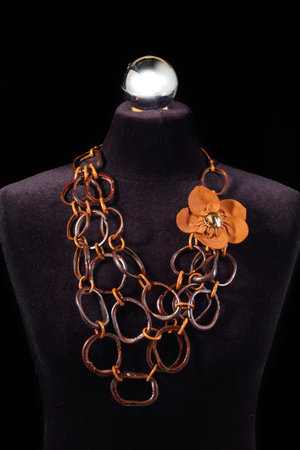 Leather necklace and stone on black mannequinの写真素材