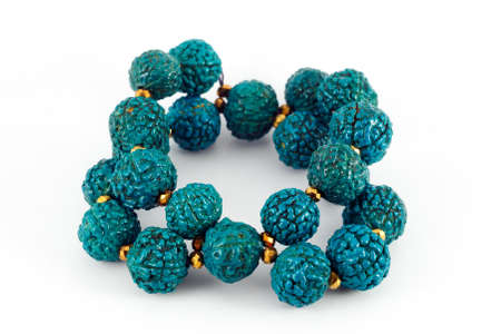 blue wooden beads bracelet isolated on whiteの写真素材